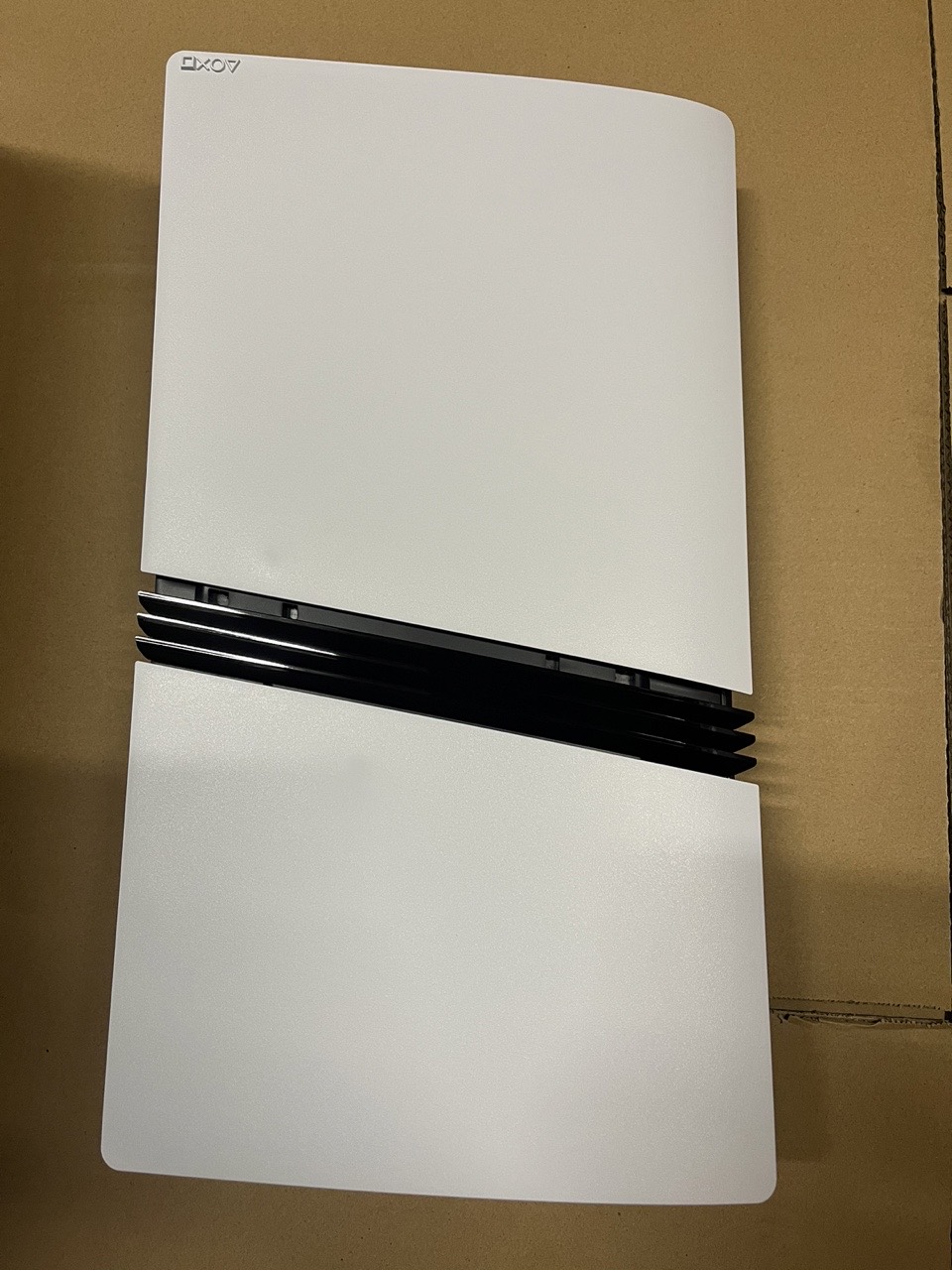 White side panels and black centre vents of a PlayStation 5 Pro console